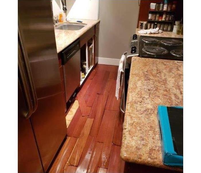 Kitchen floor damaged by water