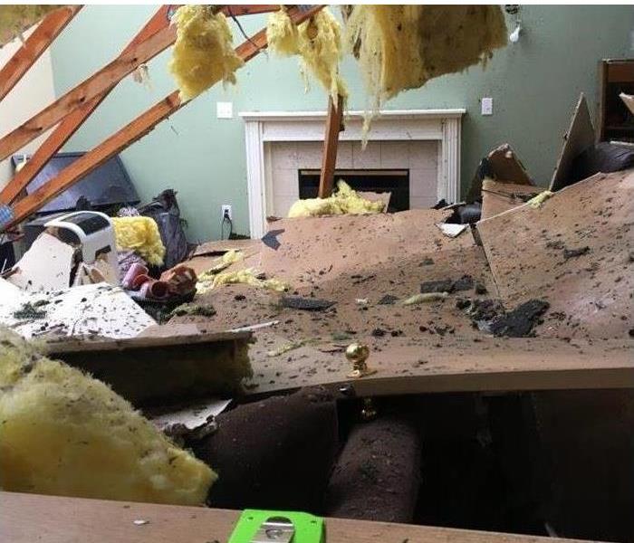 the ceiling of a house damaged by a storm